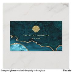 a blue and gold business card with an image of a shell on the ocean side