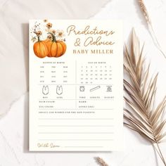 a baby announcement card with an orange pumpkin and daisies on it, next to dried grass