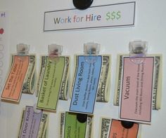 a bunch of money is hanging on the wall with some magnets attached to it