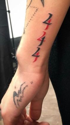 a person with a tattoo on their arm