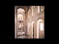 the interior of an old church with arches