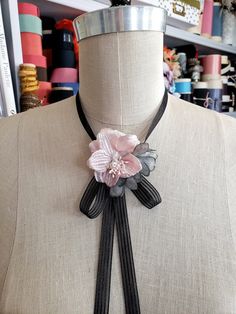 READY TO SHIP! ONE OF A KIND Inspired by the fashions from the French Belle Epoch period. Charming pale pink vintage velvet flower with tiny pink stamens in center. I added a few handmade gray silk petals. Flower sits on a beautiful black stripe organza ribbon. Choker has a small snap that fastens underneath the flower.  No need to tie onto neck. The bow is already fixed in place. I make the bow tails extra long so you can cut them to your desired length. Or leave them as is! One size fits all! Choker Velvet, Black Ribbon Choker, Belle Epoch, Bumble Bee Necklace, Velvet Flower, Ribbon Choker, Y2k Necklace, Pave Necklace, Flower Choker