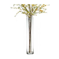 a tall glass vase with yellow flowers in it