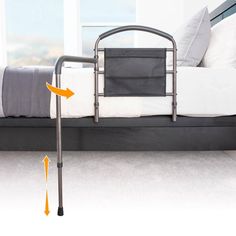 a metal bed frame with an orange arrow pointing to the mattress on it's side