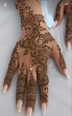 hendi tattoos on the palm of a woman's hand