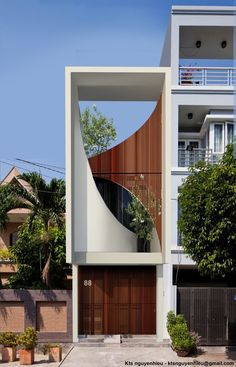 a modern house with an unusual design in the front and side windows on the second floor