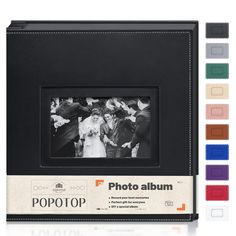 an old photo album with different colors and pictures on the front, in black leather