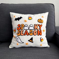 a pillow that says spooky season on it