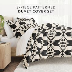 three piece patterned duvet cover set in black and white with matching pillow cases