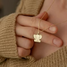 "* Material: High Quality 14K Solid Gold - Not Gold Vermeil Not Gold Plated - ( REAL SOLID GOLD ) * Metal Stamp: 14k * All our jewelry is custom made by hand with Love and Care in our workshop * 14k Solid Gold Elephant Necklace - Tiny Baby Elephant Pendant - Dainty Animal Necklace - Elephant Jewelry - Gift For Her - By Demir Uluer H O W ∙ T O ∙ O R D E R * You can choose the color of your pendant using the first box / option * You can choose the length of your chain by selecting the second option / box. * Just use the 'PERSONALIZATION BOX' to let us know the Note you want on the back of your Pendant O T H E R ∙ I N F O R M A T I O N * Material of chain: 14K Solid gold ( REAL GOLD ) It is thin and dainty and it is available in 6 sizes: - 35 cm / 13,75 inches ( Length ) - 40 cm / 15,75 inche Handmade Pendant Charm Necklaces For Birthdays, Handmade Pendant Charm Necklaces For Birthday, Handmade Pendant Charm Necklace For Birthday, Cute Handmade Necklaces For Personalized Gifts, Handmade Yellow Gold Necklace For Personalized Gift, Gold Animal Design Necklace For Gift, Gold Necklace With Animal Design For Gift, Handmade Yellow Gold Necklaces For Birthdays, Cute Handmade Gold Necklaces