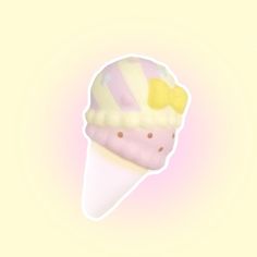 an ice cream cone with pink, yellow and white frosting on it's tip