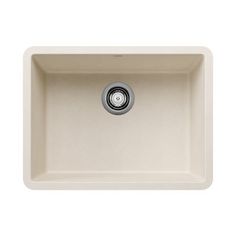 a white kitchen sink with a drain in the center and a black faucet