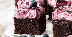 a piece of chocolate cake with blueberries on top