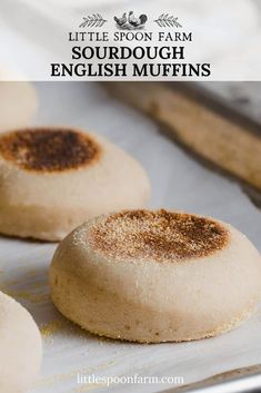 three english muffins on a baking sheet