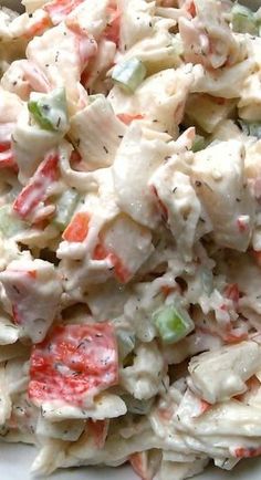 a white plate topped with a salad covered in dressing