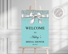 an easel with a welcome sign on it for a bridal shower or wedding