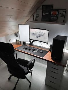 a computer desk with two monitors and a keyboard