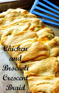 chicken and broccoli crescent crescent bread on a baking sheet with blue spatula