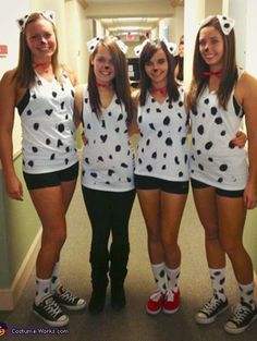 three girls dressed up as dalmatian costumes