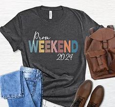 a t - shirt with the words prom weekend on it next to jeans and shoes