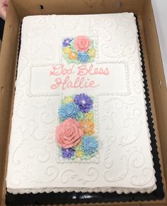 a cake in a box decorated with flowers and the words lost bliss still life on it