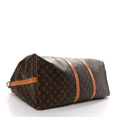 This is an authentic LOUIS VUITTON Monogram Keepall Bandouliere 60. This bag is crafted of signature Louis Vuitton monogram on toile coated dark brown canvas. The bag features a vachetta cowhide leather trim, rolled top handles, an optional shoulder strap, and gold hardware. The top zippers open the bag to a spacious cocoa brown fabric interior. Cocoa Brown, Brown Fabric, Brown Canvas, Leather Trim, Authentic Louis Vuitton, Cowhide Leather, Leather Trims, Gold Hardware, Louis Vuitton Monogram