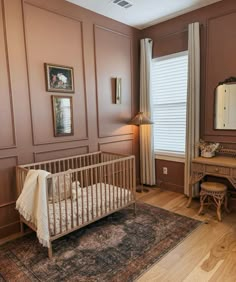 a baby's crib in the corner of a room