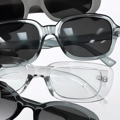 several pairs of glasses sitting on top of each other