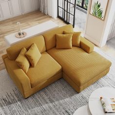 a living room with a sectional couch and coffee table