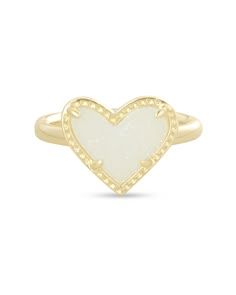 What's not to love about the Ari Heart Gold Band Ring in Iridescent Drusy, defined by an asymmetrical design of one of the world's most iconic symbols? Metal 14k Yellow Gold Over Brass Material Iridescent Drusy Size 0.57"L x 0.5"W Material Highlight: Drusy Drusy is the natural crystallization on a rock surface. All of our Drusy is genuine and has a rich sparkling appearance. Our range of Drusy colors are achieved by a custom plating process that coats the stone's surface. Learn more about Drusy Preppy Jewlery, Preppy Ring, Office Tour, Closet Office, Iconic Symbols, Bag Chanel, Vacation Outfit