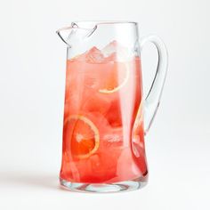 a pitcher filled with water and orange slices