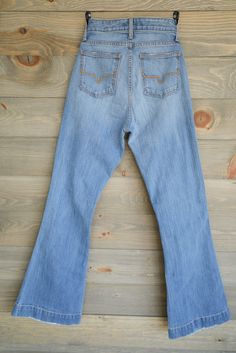 Jennifer Sugar Fade Kimes Ranch Performance Jeans in Blue Denim The distressed Jennifer Sugar Fade is one of our favorite Kimes Ranch jeans as it has an amazing fit with that tiny bit of comfortable stretch in a great tone of enzyme washed blue denim. Features high rise, flare leg, 32 and 34 inch inseam, 4 pockets, and Kimes Ranch horn logo on rear pocket. Perfect for riding or a night out on the town! These jeans have the longevity and durability you demand because Kimes only source Ring Spun d Kimes Ranch Jeans, Kimes Ranch, Faded Jeans, High Jeans, High Waisted Shorts, Bell Bottom Jeans, Horn, Blue Jeans, Levi Jeans