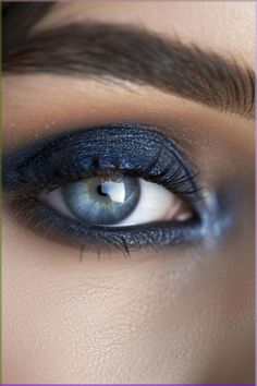 Intensify the depth of your blue eyes with a smoky sapphire eyeshadow look that adds drama and allure. #sapphireeyeshadow #smokyeyes #blueeyes #makeup #eyemakeup Dramatic Makeup For Blue Eyes, Makeup Ideas For Grey Eyes, Eyeshadow Ideas For Blue Eyes, Porcelain Skin Makeup, Navy Blue Eyeshadow, Brown Hair And Grey Eyes, Mom And Newborn, Red Eyeshadow Look, Grey Eye Makeup