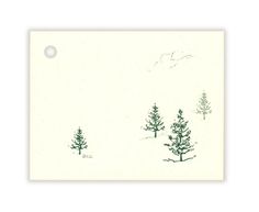 a card with trees in the snow on it