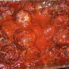 a casserole dish with meatballs covered in sauce