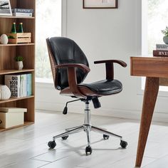 an office chair sitting on top of a wooden desk next to a bookshelf