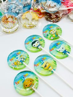 several lollipops with cartoon characters on them