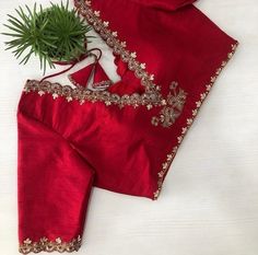 Hand embroidered ready made saree blouse / crop top/stitched saree blouse usa / red saree blouse/modern blouse/zardosi blouse/red saree blouse/ pure silk blouse/ maggam work blouse        It is very true that a perfect blouse is the one which makes your saree look stand out !! If you find one of such a style that you have been wanting to have then dont let it go !! we carry such unique trending blouses that instantly add a stylish look to any saree !!      Here is a beautiful Hand embroidered zardosi work saree blouse in red color that has V neck design front and back  emblished with gold and antique scallop embroidered on neck sleeves  front and back as shown!! Runs with any self or contrast color saree ! Please message us for any color / size customization !!  Fabric : pure raw silk  Lin Embroidery Blouses For Sarees, Red Blouse Designs For Saree, Red Silk Saree With Contrast Blouse, Modern Blouse Designs Back Neck, V Neck Blouse Work Design, Unique Blouse Embroidery Designs, Embroidery On Blouse Sleeves, Red Designer Blouse For Sarees, Blouse Unique Design Style