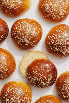 several buns with sesame seeds on them