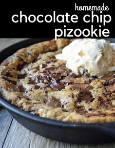 chocolate chip pizza with ice cream on top in a cast iron skillet, ready to be eaten