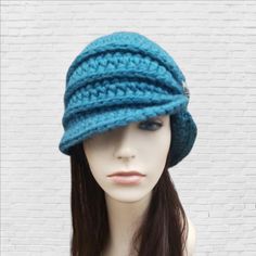 This womans winter hat is inspired by the flapper style hats of the 1920s. It is hand crocheted with soft wool blend yarn in teal.  The bottom of the hat flares out slightly and the gathering has glass hand-beaded knot detail in brushed silver glass beads.  Hat Sizing small: 20-21in / 50-54cm medium: 22-23in / 55-60cm  large: 24-25in / 61-64cm custom: for head measurements outside standard sizing please contact me for adjusted pricing.  ~~Kids sizes available. Stripped Beanie, 1920s Hat, Hippie Hat, Crochet Slouchy Beanie, Crochet Winter Hats, Flapper Hat, Crochet Fingerless Gloves, Hat And Scarf Sets, Flapper Style