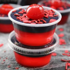 red desserts in plastic containers with sprinkles on the top and bottom