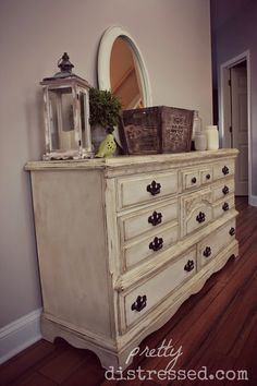 an old dresser with drawers and baskets on top