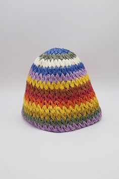 a multicolored knitted hat on a white background