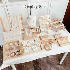 the display set is full of jewelry and bracelets, including necklaces, earrings, and rings