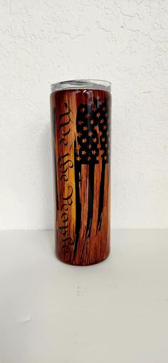 a wooden cup with an american flag painted on it