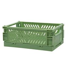 a green plastic crate on a white background