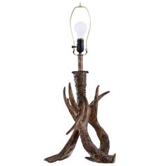 an antler lamp with a light bulb on it