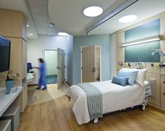 an image of a hospital room with the caption'emphasis is placed on the handwashing sinks at fort belfort through the use of floor patterns, wall treatments and lighting