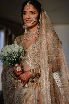 gold bridal lehenga ideas for 2022 brides Gold Bridal Lehenga With Red Dupatta, Indian Bridal Lehenga Gold, Gold Lehenga With Red Dupatta, Best Indian Bridal Look, Gold Bridal Lengha With Red Dupatta, Champagne Lengha Bridal, Pink And Gold Wedding Lengha, Rose Gold Indian Wedding Dress, Indian Wedding Outfits Bridal Lehenga Red And Gold